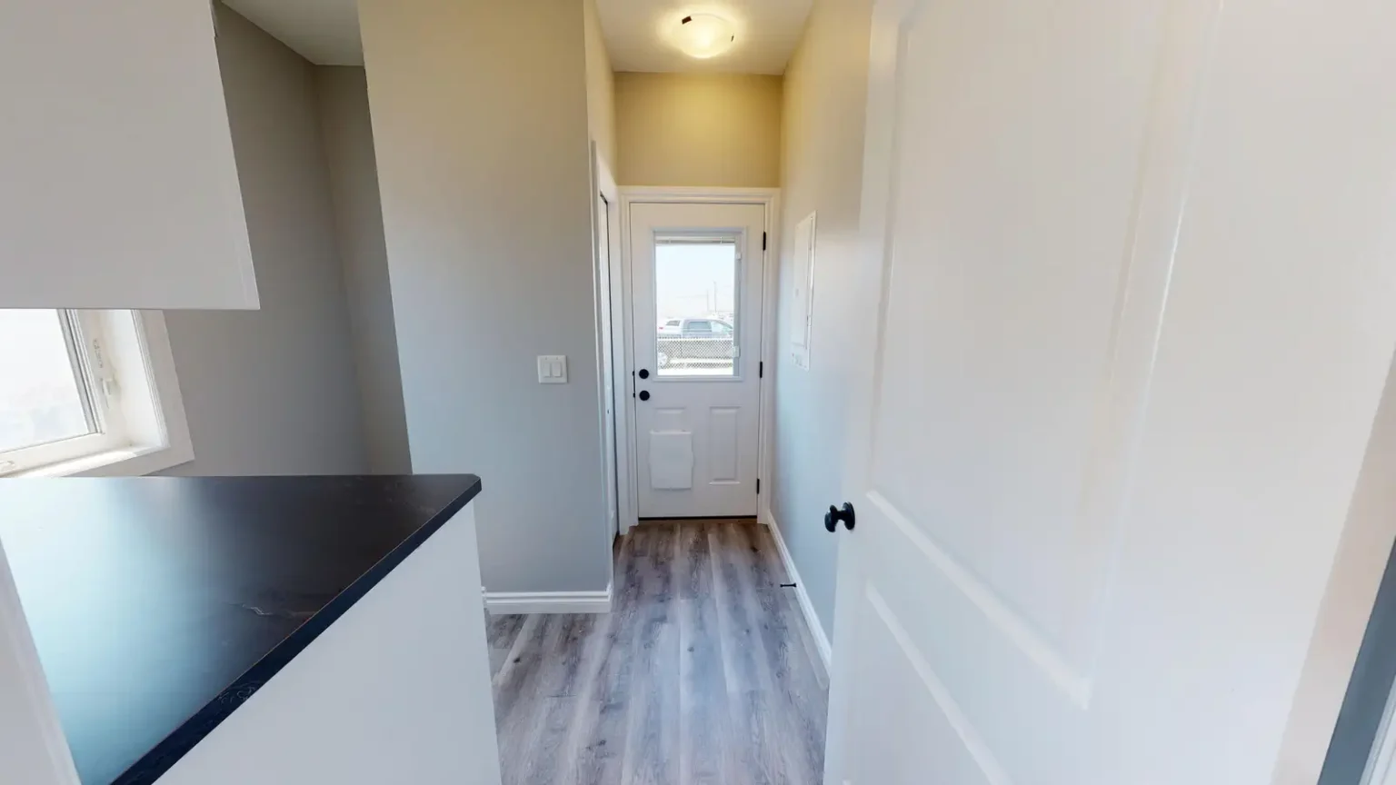 Tiger Eye Hall to Mudroom and Rear Entry